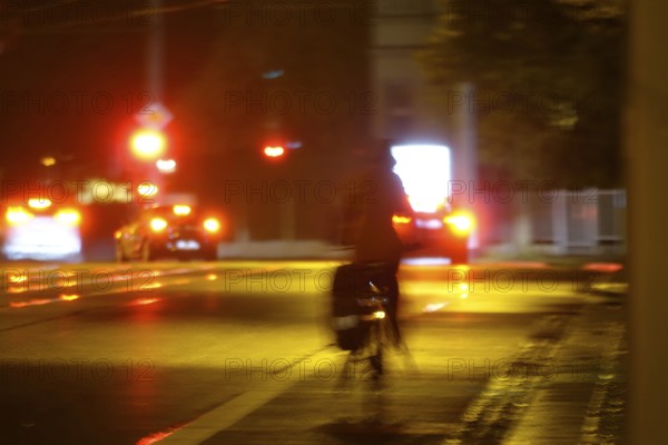Road traffic at night and poor visibility in a city, autumn, Germany