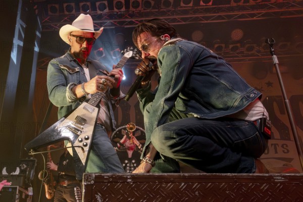 Stefan Bühler (Russ T. Rocket), guitarist, and Alec Völkel (Boss Burns), singer of the band The BossHoss on their Back To The Boots Tour 2025 at Capitol Hannover on 3 October 2025