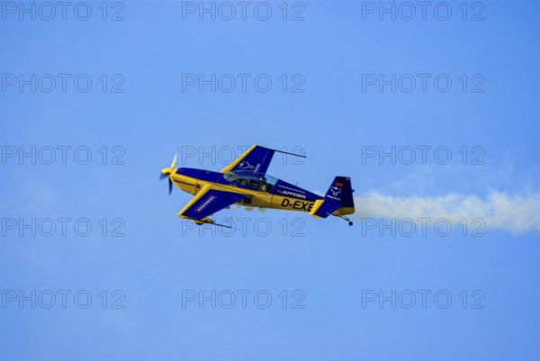 An Extra EA-300 of Extra Flugzeugproduktions- und Vertriebs GmbH with the registration D-EXBH during a flight demonstration as part of an air show at the Rossfeld in Metzingen-Glems, Baden-Württemberg, Germany, for editorial use only