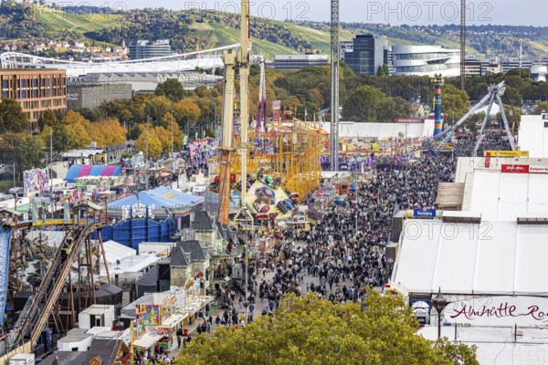 The 178th Cannstatter Volksfest on the Wasen attracted 4.2 million visitors. The Wasenrummel is one of the most important traditional festivals in Germany. In the background is the headquarters of Mercedes-Benz Group AG. Bad Cannstatt, Stuttgart, Baden-Württemberg, Germany