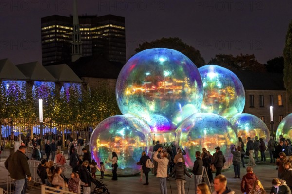 The 10th Essen Light Festival, in the city centre, second largest light art festival in Germany, light art on the Burgplatz, Evanescent light installation, by the Australian artist duo Atelier Sisu, large bubble-like spheres, with light and sound, town hall, cathedral, Essen, North Rhine-Westphalia, Germany