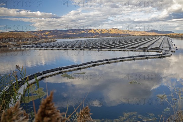 Park City, Utah - Floating solar panels provide power for Mountain Regional Water. The solar array is on the raw water storage pond at the water utility's Signal Hill Treatment Plant