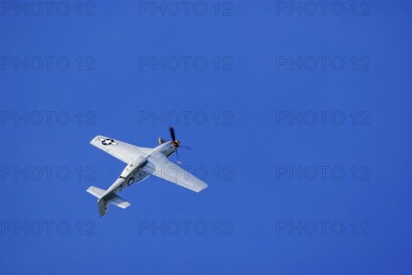 A North American P-51 Mustang of the flying group Flying Bulls, the Nooky Booky IV during an air show at the Rossfeld in Metzingen-Glems, Baden-Württemberg, Germany, for editorial use only
