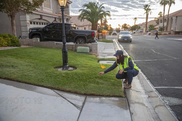 Las Vegas, Nevada - Devyn Choltko, a water waste investigator, patrols a residential neighborhood issuing tickets for illegal water use. The Las Vegas Valley Water District has cut usage of scarce Colorado River water by more than 30% over the last 20 years despite a growing population