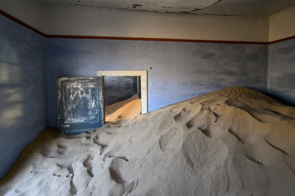 Sand mountains in a former dwelling house, interior photograph, Kolmanskop, restricted diamond area, near Lüderitz, Karas region, Namibia