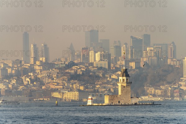 The Maiden Tower lighthouse, Leander Tower or Maiden Tower in front of the skyline of Istanbul, Turkey