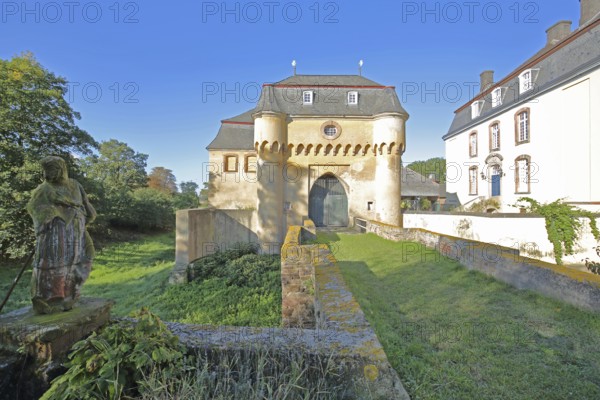 Portal with archway, large castle built in the 18th century, bridge, castle moat, Kleinbüllesheim, Euskirchen, Vordereifel, Eifel, North Rhine-Westphalia, Germany