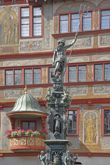 Neptune fountain with sculpture of Neptune Roman god of the sea with trident on the house facade with wall painting and decorations, Renaissance town hall with pulpit, pulpit bonnet, Am Markt, Tübingen, Neckartal, Baden-Württemberg, Germany