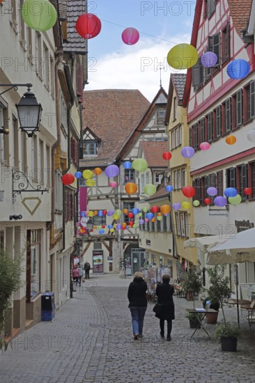Houses in the Marktgasse with colourful lanterns, decoration, balloons, pedestrians, city museum, shopping, stroll, idyll, Tübingen, Neckartal, Baden-Württemberg, Germany