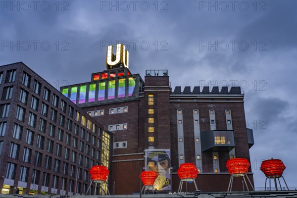 Illuminated sculptures of Dortmund roses in front of Dortmund's landmark U, Centre for Art and Creativity at dusk, Dortmund, North Rhine-Westphalia, Germany
