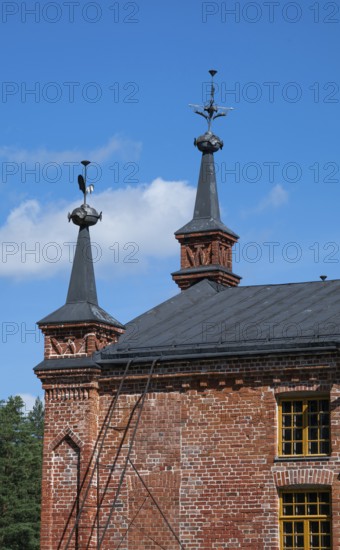 Gable with weather vane and ornamental iron elements, former paper factory and mill for the production of groundwood pulp board, UNESCO World Heritage Site Verla Factory Village, Maailmanperintökohde Verlan puuhiomo ja pahvitehdas, Verla Rapids, Kymenlaakso, near Kouvola, Finland