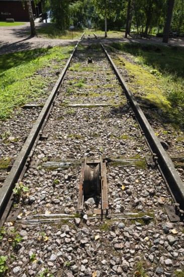 Railway line leads to Lake Väha Kamponen, former paper mill for the production of groundwood pulp board, UNESCO World Heritage Site Verla Factory Village, Maailmanperintökohde Verlan puuhiomo ja pahvitehdas, Verla Rapids, Kymenlaakso, near Kouvola, Finland