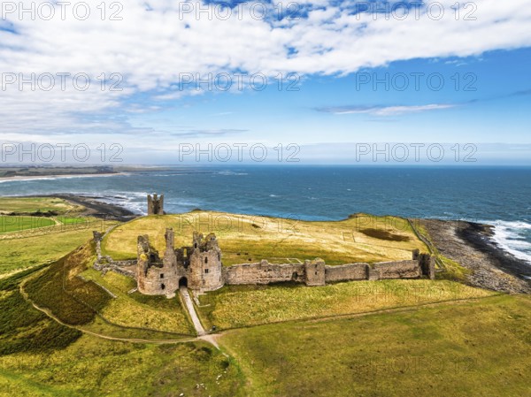 Dunstanburgh Castle from a drone, Northumberland Coast, England, United Kingdom
