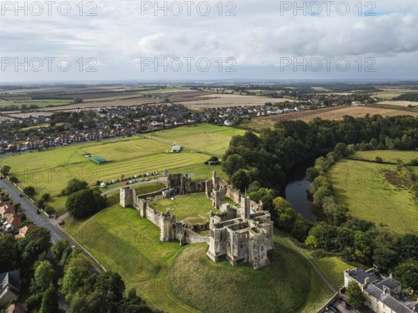 Warkworth Castle over River Coquet from a drone, Warkworth, Northumberland, England, United Kingdom