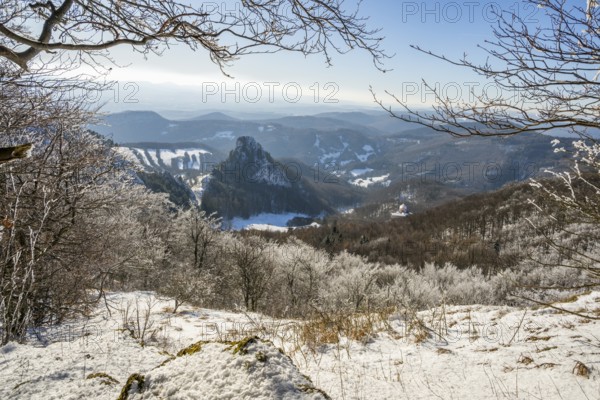 View over the hills and valleys from the mountain with hoarfrost on the branches in winter, Vápec, Horná Poruba, Slovakia