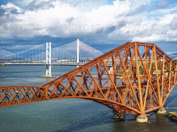 Forth Bridge from a drone, Queensferry Crossing, Forth Estuary, Scotland, United Kingdom