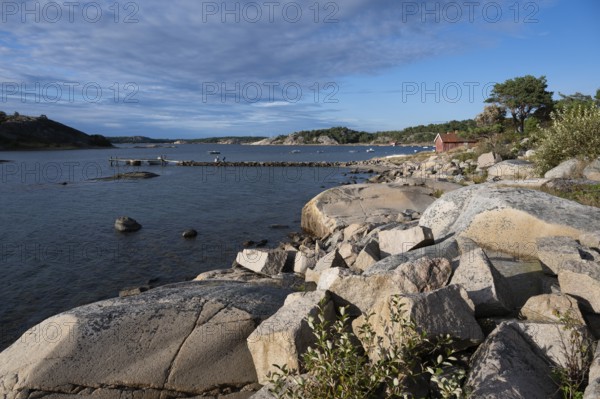 Falun red or Swedish red boathouse, Bohus granite, Resö island, Bohuslän, Skagerrak, Sotenäs, Västra Götalands län, Sweden