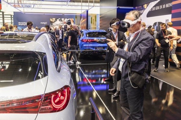Mercedes trade fair stand with virtual presentation. Trade fair visitors with 3D glasses. The Virtual Ride. CLA Shooting Brake. IAA MOBILITY in Munich. The motor show presents itself as a holistic mobility trade fair. But cars are still the centre of attention. Munich, Bavaria, Germany