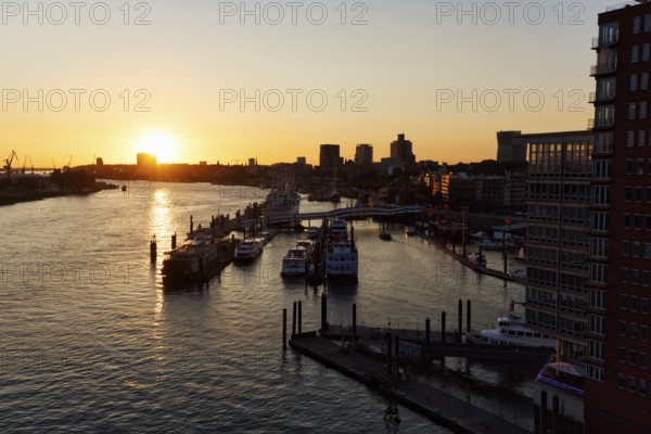 Hamburg harbour, view from the Elbphilharmonie over the Elbe at sunset, jetty, cranes of the container port on the horizon, Hamburg, Germany
