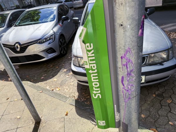 Lamp charging column of Stadtwerke Düsseldorf in the city centre of Düsseldorf, Germany, digitally reworked
