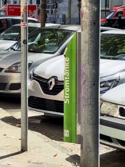 Lamp charging column of Stadtwerke Düsseldorf in the city centre of Düsseldorf, Germany, digitally reworked