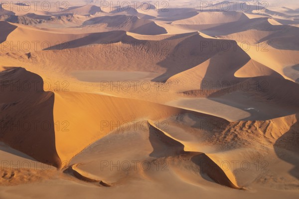 Sand dunes in the Namib Desert. In the evening. Aerial view. Namib-Naukluft Park, Namibia