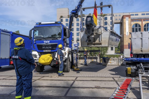Launching, with crane, of a THW multi-purpose boat in front of a training trip on the Rhine, near Düsseldorf, of the Water Hazards Section, this type of boat is used to transport people and goods as a rescue boat and as a working platform, during the major exercise FÜLEX25, lasting several days, of the THW, Technical Relief Organisation, North Rhine-Westphalia Regional Association, over 3500 volunteers from the 127 North Rhine-Westphalia local associations practise many different deployment scenarios over 4 weekends