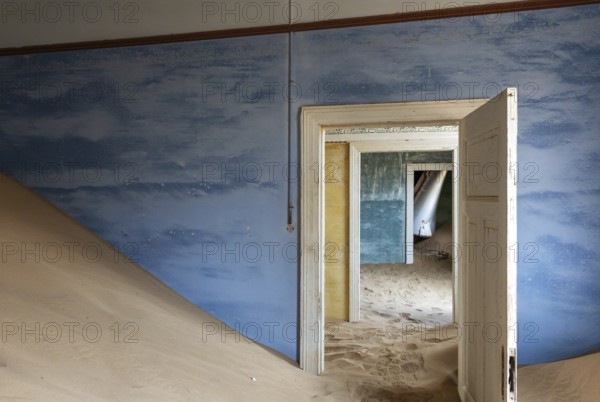 At Kolmanskop, the abandoned ghost town of the diamond days of the early 1900 and of German origin. Inside the restricted Diamond Area east of the coastal town of Lüderitz. Namib Desert, Namibia
