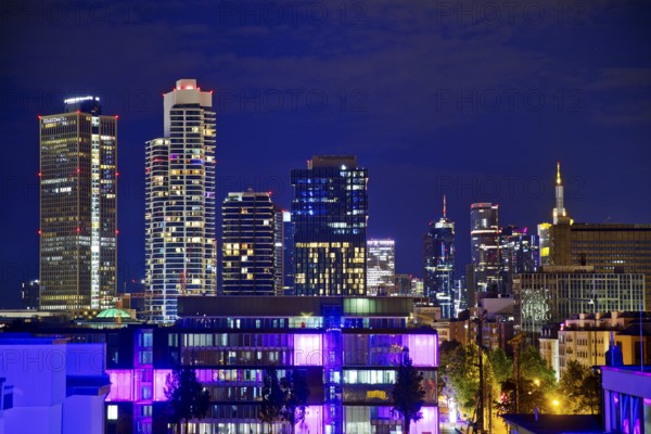 Rooftop day with colourfully illuminated houses for a techno party on the roof with a view of the skyline, Frankfurt am Main, Hesse, Germany
