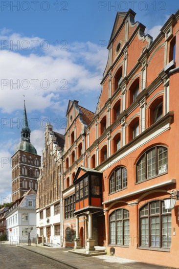Magnificent row of houses with gables, St Nikolai Church tower at the back left, Old Town, Badenstraße, Unesco World Heritage Site, Stralsund, Mecklenburg-Western Pomerania, Germany