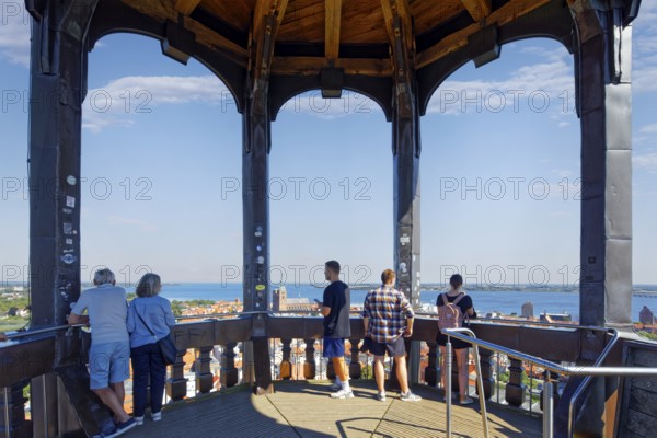 Visitors look out over the city, viewing platform view at a height of 84 metres, St. Mary's Church, also known as Marienkirche, basilica, late Gothic, three naves with transept, first mentioned in 1298, Neuer Markt, Old Town, UNESCO World Heritage Site, Hanseatic City of Stralsund, Mecklenburg-Western Pomerania, Germany