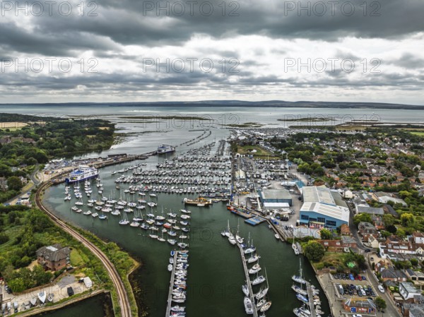 Wight Light car ferry to Isle of Wight on Lymington River and marina from drone, Lymington, New Forest, Hampshire, England, United Kingdom