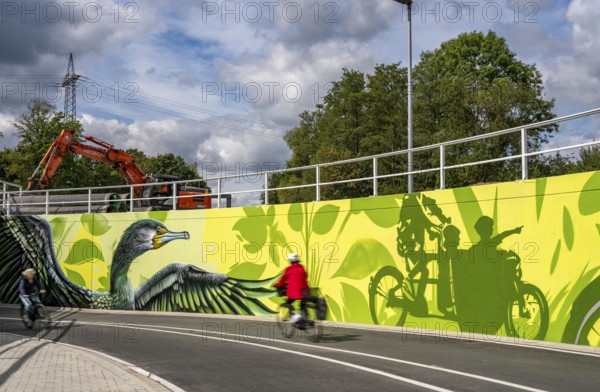 New bicycle tunnel at the junction of the B51 and Warendorfer Straße, in Münster, a bicycle and pedestrian tunnel, 150 metres long, 5.50 metres wide, crosses under the busy roads so that cyclists and pedestrians can pass without crossing, route to and from Münster city centre, visually designed with local motifs as murals, by Lackaffen.de, modern bicycle infrastructure, North Rhine-Westphalia, Germany