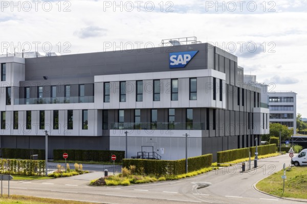 Logo and building of the software company SAP SE. Walldorf, Baden-Württemberg, Germany