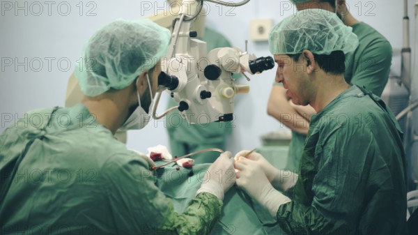 Several doctors performing a complex surgical operation inside an operating room for a displaced patient. Aleppo, Syria. October 18, 2022, Aleppo, Syria
