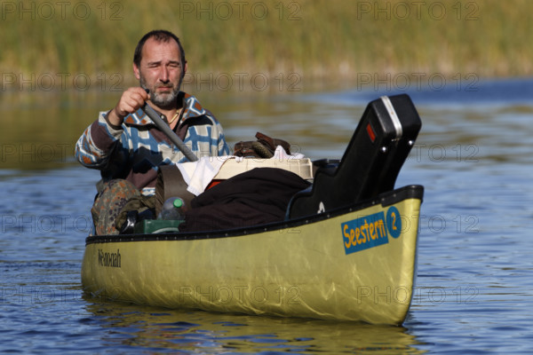 Canoeists in a canoe, Müritz National Park, Mecklenburg-Western Pomerania, Germany