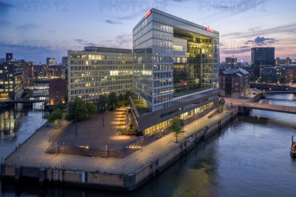 Aerial view of the Spiegel building at Ericusspitze in Hamburg's HafenCity in the Brooktorkai neighbourhood at blue hour, Hamburg, Germany