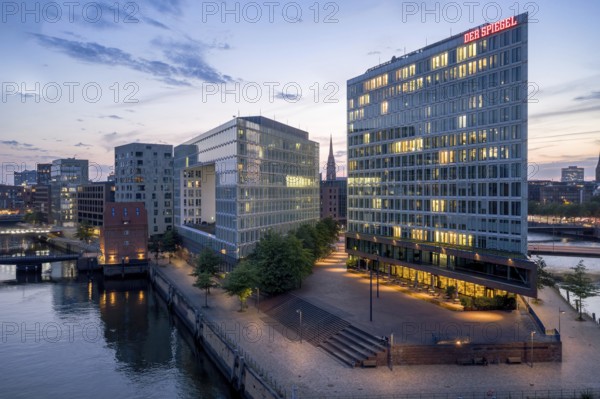 Aerial view of the Spiegel building at Ericusspitze in Hamburg's HafenCity in the Brooktorkai neighbourhood at blue hour, Hamburg, GermanyDefault