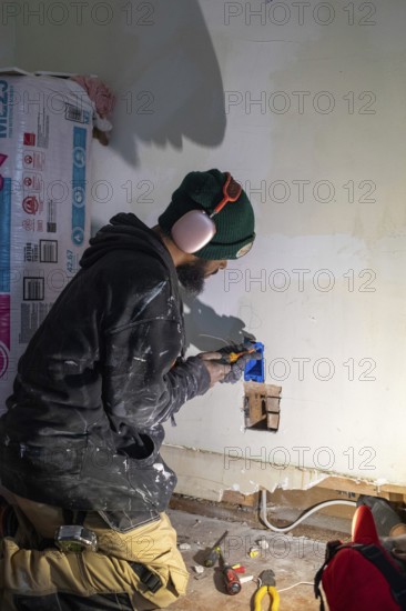 Detroit, Michigan - Workers remodel a house in the Morningside neighborhood that had been vacant for many years. Detroit lost nearly two-thirds of its residents from 1950 to 2020 but has been growing modestly in recent years