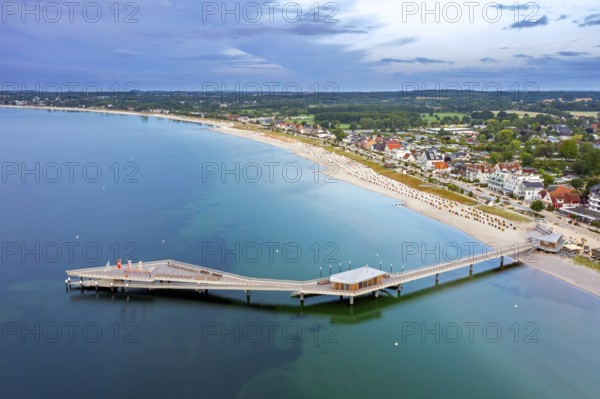 Aerial view over Seebrücke, pier and sandy beach at seaside resort Haffkrug along the Baltic Sea, Scharbeutz, Schleswig-Holstein, Germany