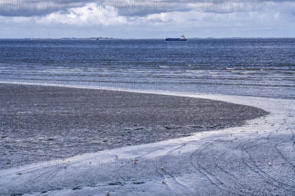 Wadden Sea between the Dutch coast near Eemshaven and the German North Sea island of Borkum, Wadden Sea National Park, UNESCO World Heritage Site, low tide, low water, clouds