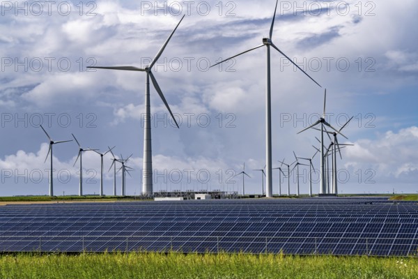 Vopak Solarpark Eemshaven, 19 hectares of solar modules with a capacity of 25 megawatts, around the Vopak tank terminal in the industrial harbour of Eemshaven, wind farm, Netherlands