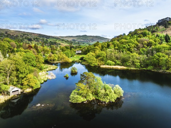 Farms and Mountains over road A591 from a drone, Grasmere Lake, Grasmere, Ambleside, Lake District, Westmorland, Cumbria, UK