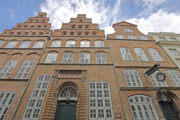 Historic Schabbelhaus built in the 18th century with stepped gable, brick building, nose sign, Mengstraße, Old Town, Lübeck, Schleswig-Holstein, Germany