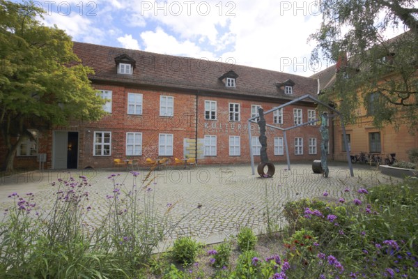 Cultural Forum and Schleswig-Holstein House, brick building, sculpture, inscription, Schelfstadt, Schwerin, Mecklenburg-Western Pomerania, Germany
