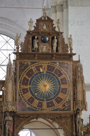 Rood screen with Gothic clock built in 1477 with decorations and figures, interior view, church clock, detail, clock face, Lübeck Cathedral, Schleswig-Holstein, Germany