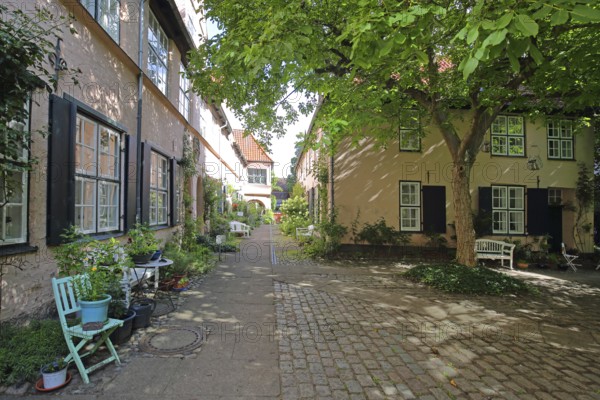 Idyllic Füchtingshof with flower decoration, chairs, plants, flowers, backyard, decoration, idyll, courtyard, corridors, courtyards, Glockengießerstraße, Old Town, Lübeck, Schleswig-Holstein, Germany