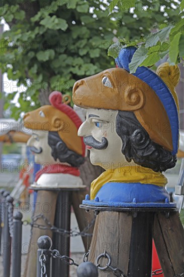 Colourful Swedish heads as landmarks, historical wooden head with face and four eyes, Swedish head tree house, Old Harbour, Wismar, Mecklenburg-Western Pomerania, Germany