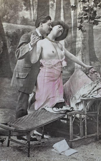 Female nude from around 1899, erotic postcard, playgirl, couple dancing passionately on a bench in a forest, expression of joy, coloured, reproduction of a photo from around the turn of the century, historical, digitally restored reproduction of an old original, exact date unknown