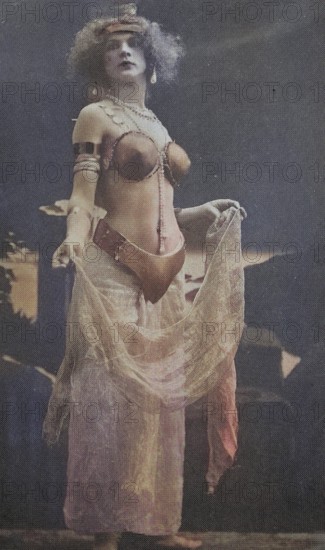Female nude from around 1899, erotic postcard, playgirl, woman in an elaborate oriental costume in nostalgic colours on a stage, coloured, reproduction of a photo from around the turn of the century, historical, digitally restored reproduction of an old original, exact date unknown